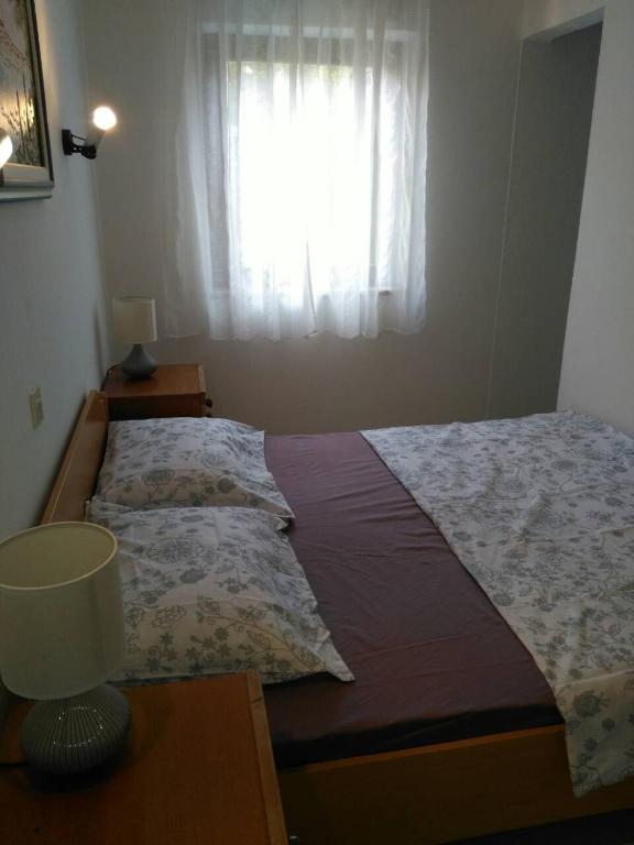 Łóżko lub łóżka w pokoju w obiekcie Apartment Bozac
