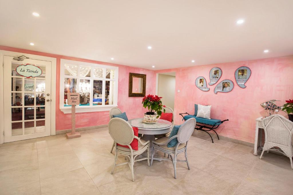 a dining room with a table and chairs at Sugar Bay Barbados - All Inclusive in Bridgetown