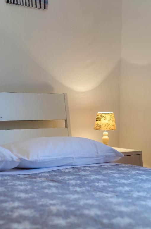 Postel nebo postele na pokoji v ubytování Apartmani Prodan 2