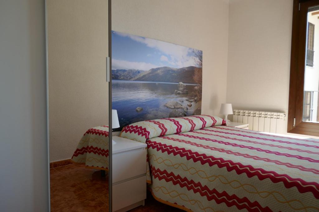 Postel nebo postele na pokoji v ubytování Apartamentos La Muralla