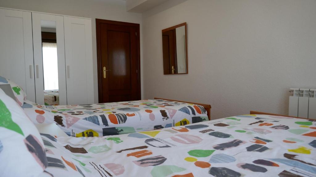 Postel nebo postele na pokoji v ubytování Apartamentos La Muralla