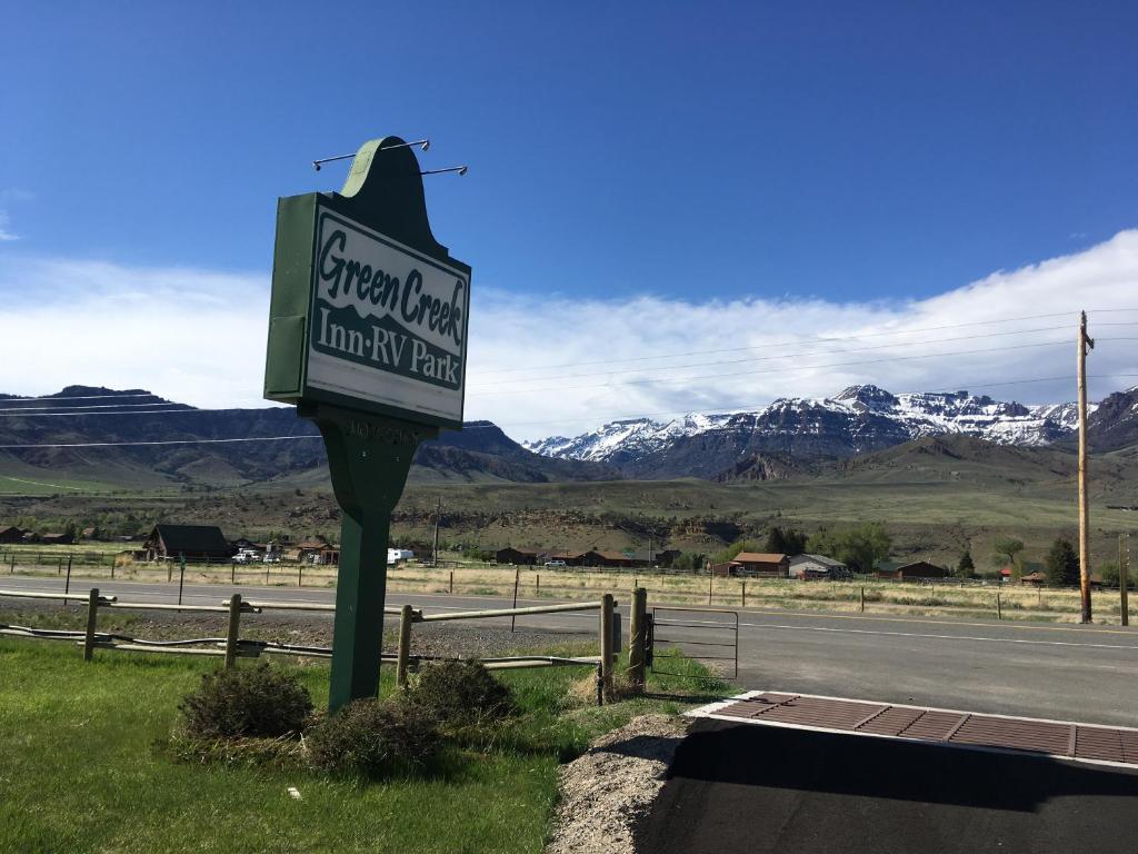 a sign on the side of a road at Green Creek Inn and RV Park in Wapiti