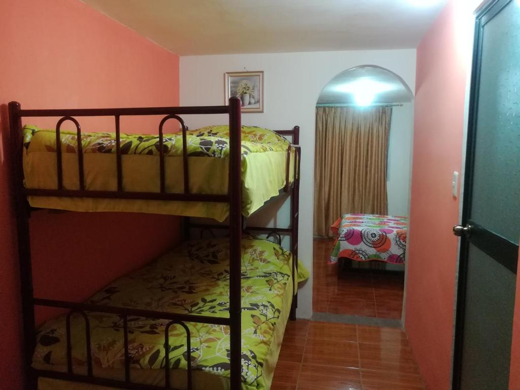 Postel nebo postele na pokoji v ubytování Hostal Mariscal Sucre