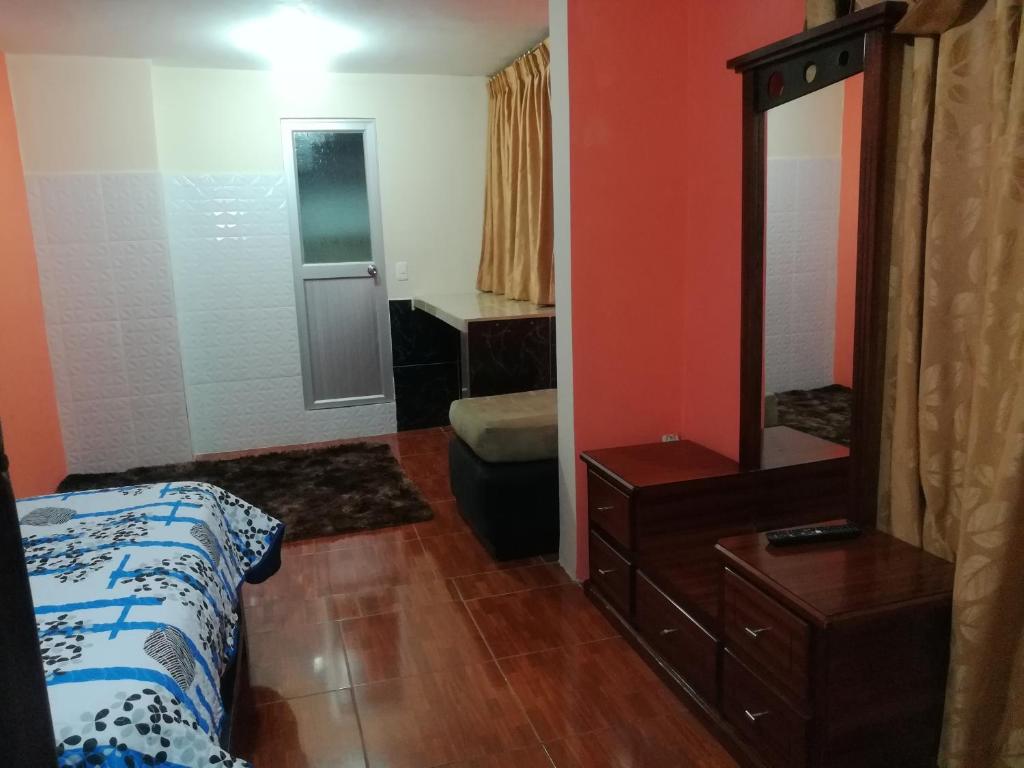Postel nebo postele na pokoji v ubytování Hostal Mariscal Sucre