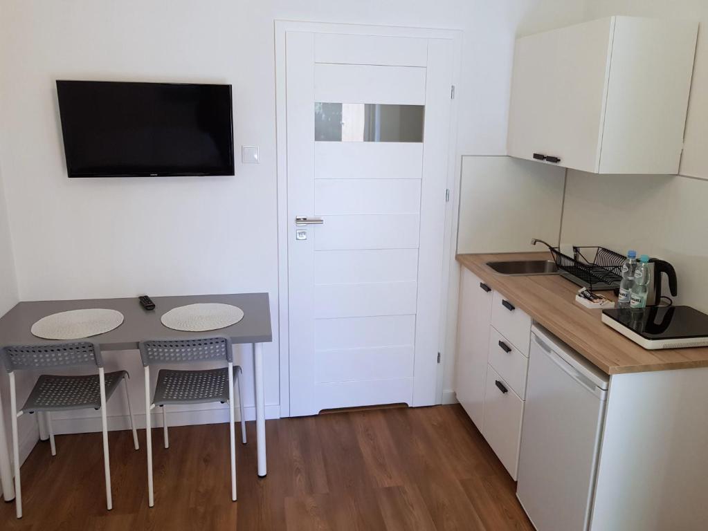 Kuchyňa alebo kuchynka v ubytovaní Apartamenty METRO Targówek