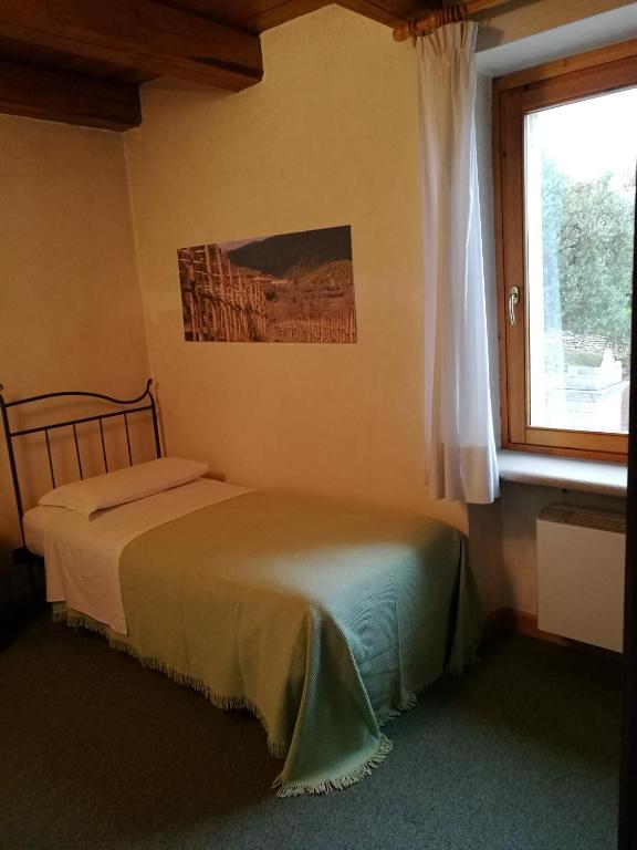 Postel nebo postele na pokoji v ubytování Costa degli Ulivi