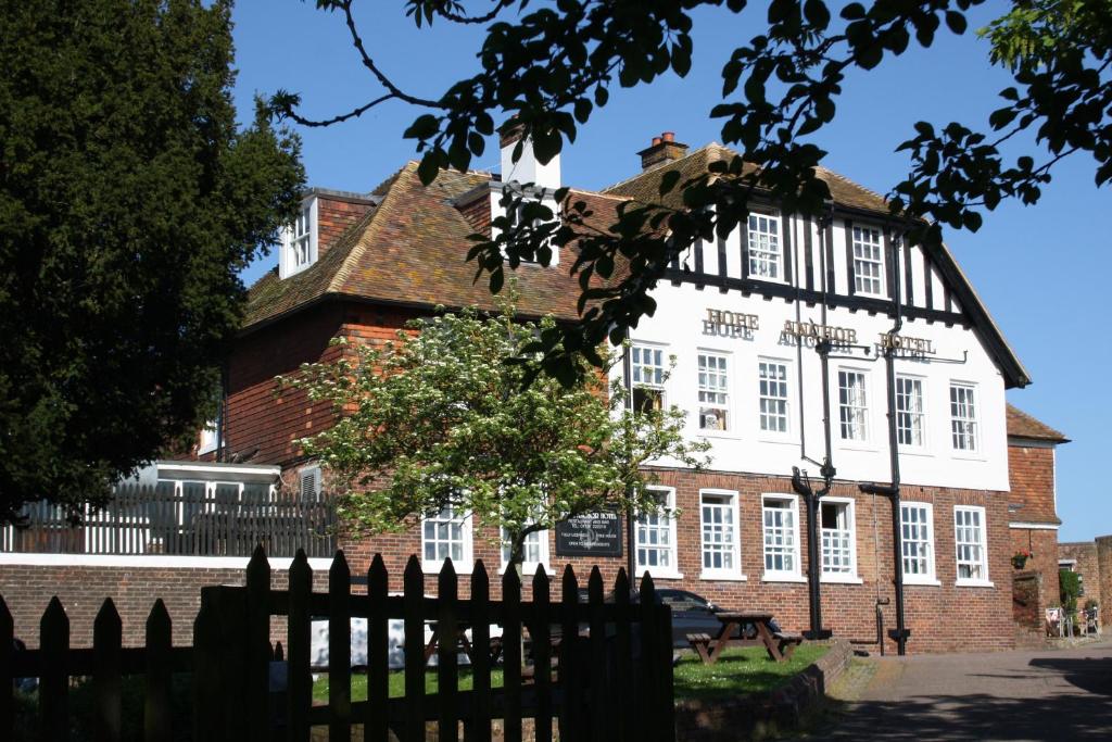 an old building with a fence in front of it at The Hope Anchor in Rye