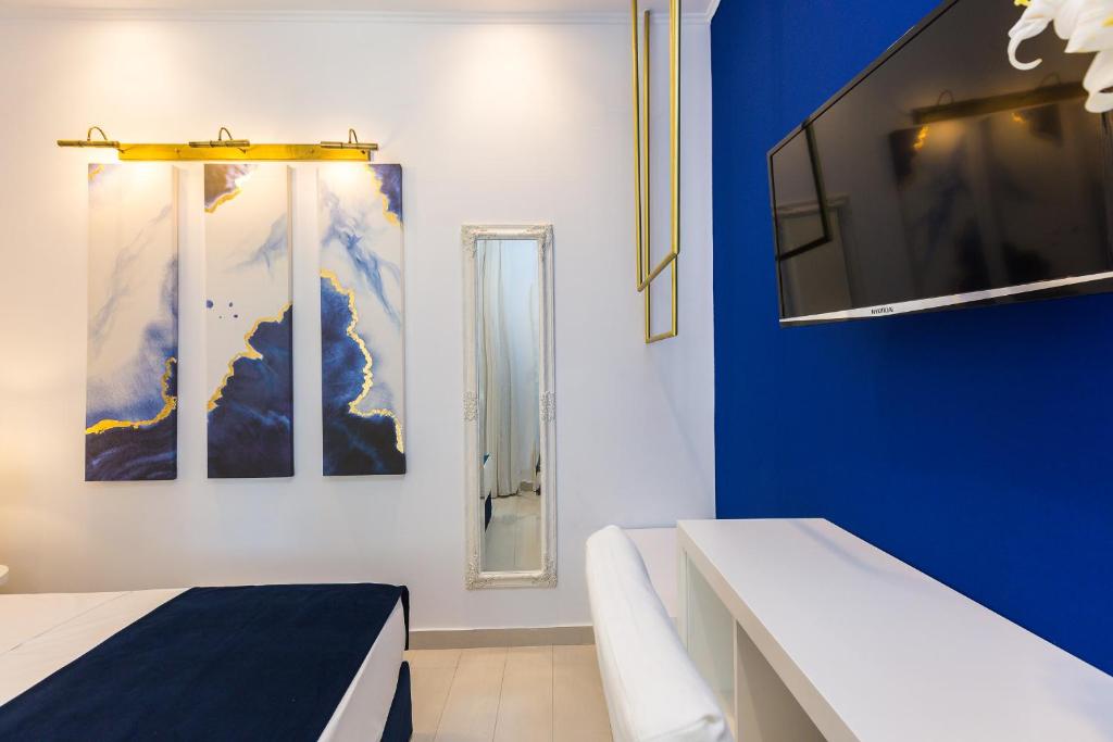 Łóżko lub łóżka w pokoju w obiekcie Georgioupolis Plaza Suites