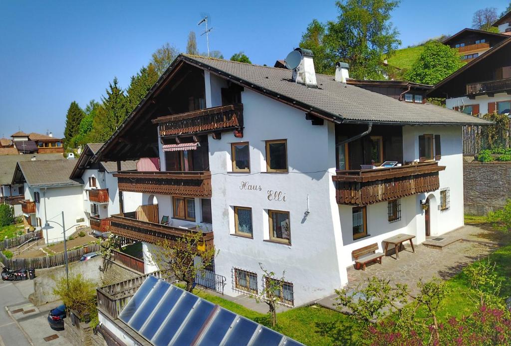 a house with a solar panel in front of it at Haus Elli in Nova Ponente