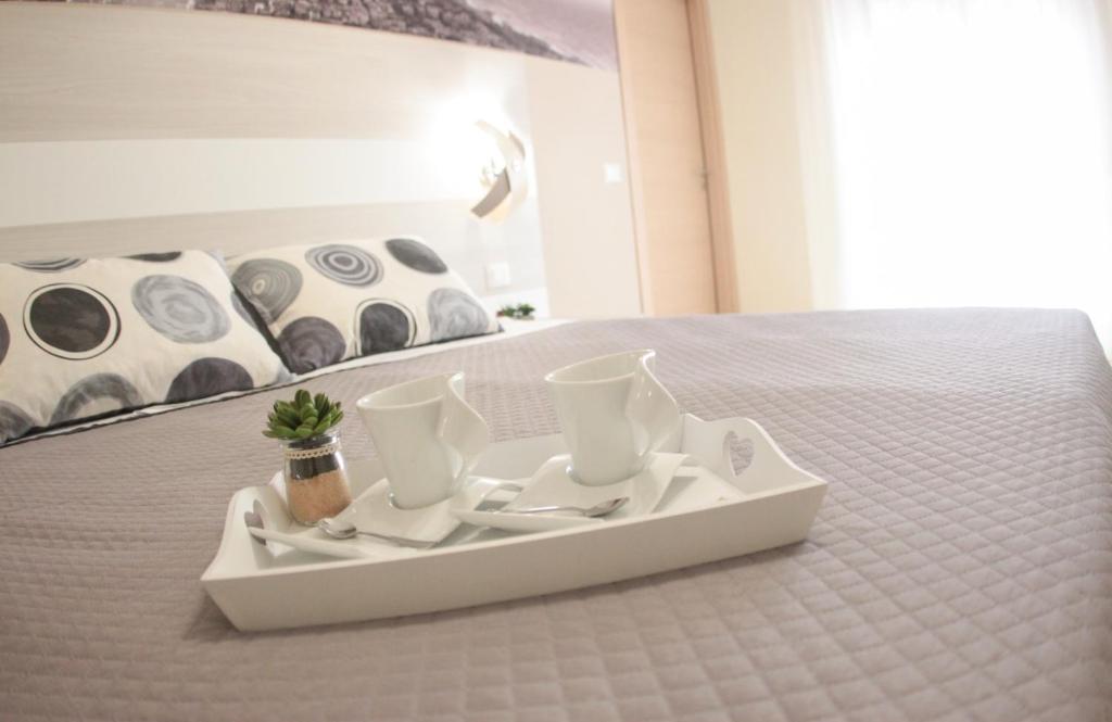 Postel nebo postele na pokoji v ubytování A'MANTIA HOTEL