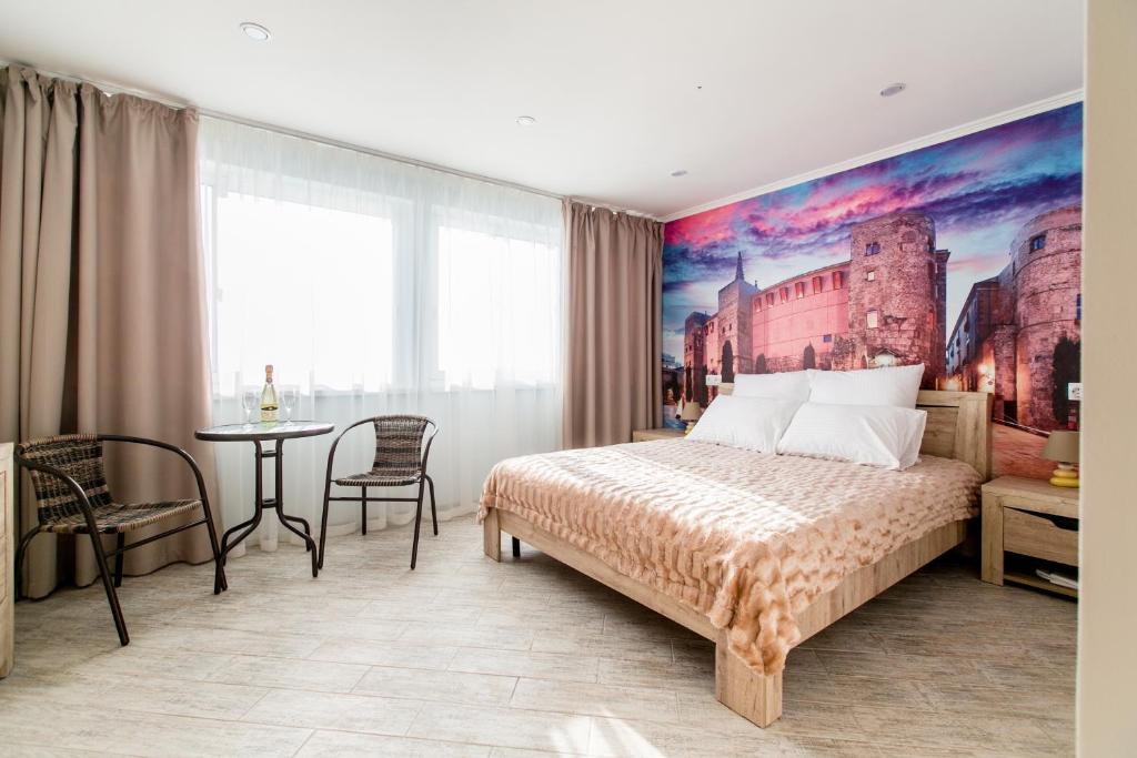 Postel nebo postele na pokoji v ubytování Hotel Vokrug Sveta