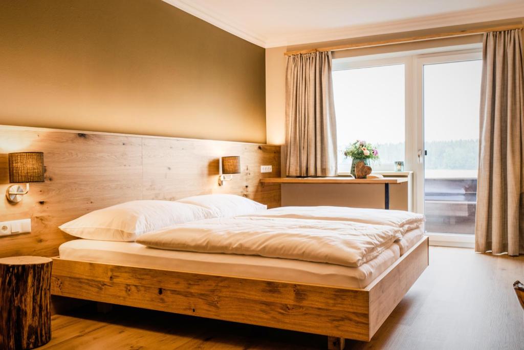 Postel nebo postele na pokoji v ubytování Hotel z'Leithen