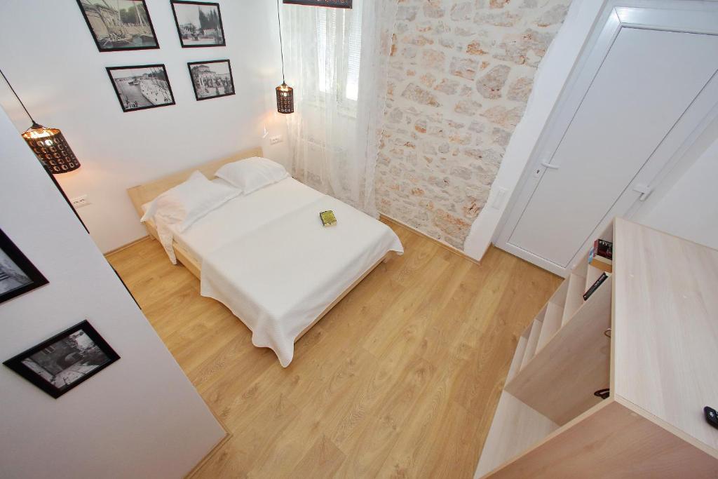 Postel nebo postele na pokoji v ubytování Guverna New City Accommodation