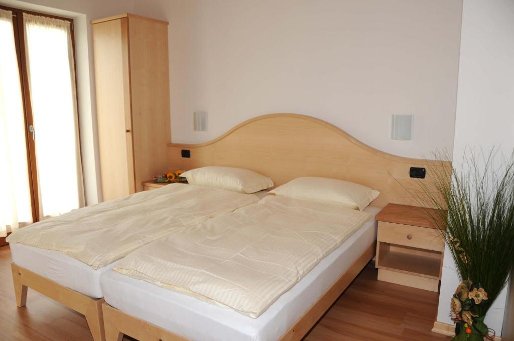 Łóżko lub łóżka w pokoju w obiekcie Agritur alla Veduta