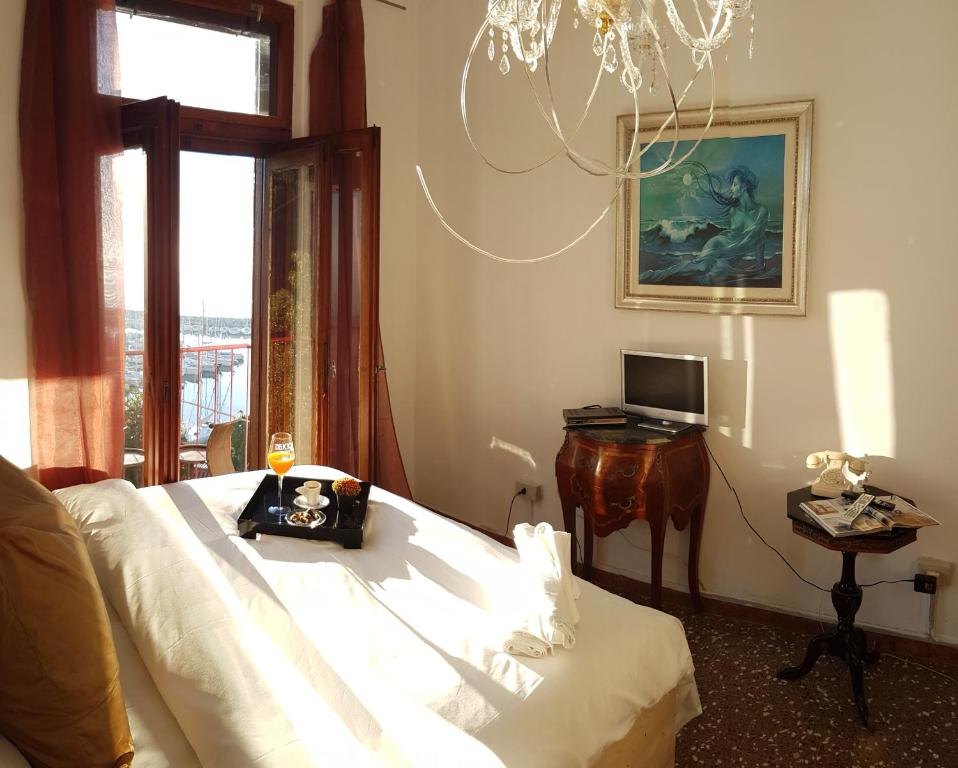 Postel nebo postele na pokoji v ubytování Hotel Mignon