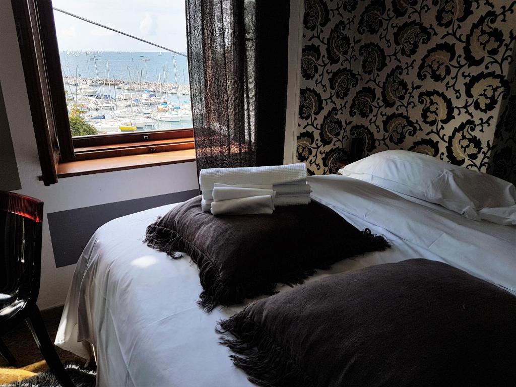 Postel nebo postele na pokoji v ubytování Hotel Mignon
