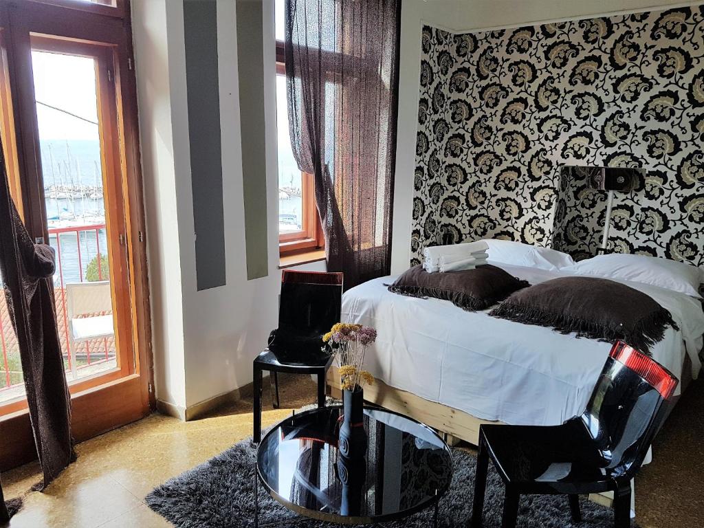 Postel nebo postele na pokoji v ubytování Hotel Mignon