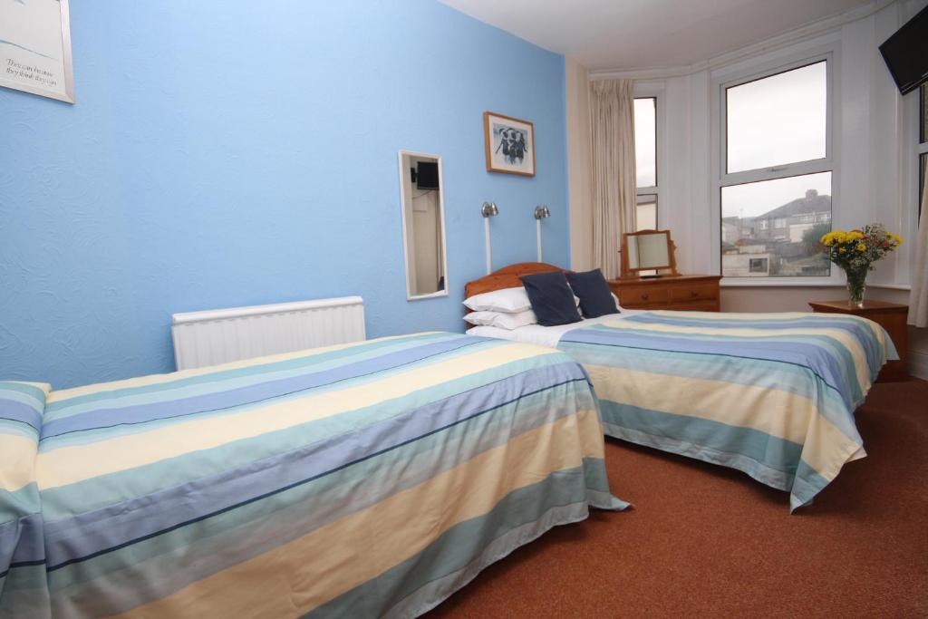 Letto o letti in una camera di Surfside Stop