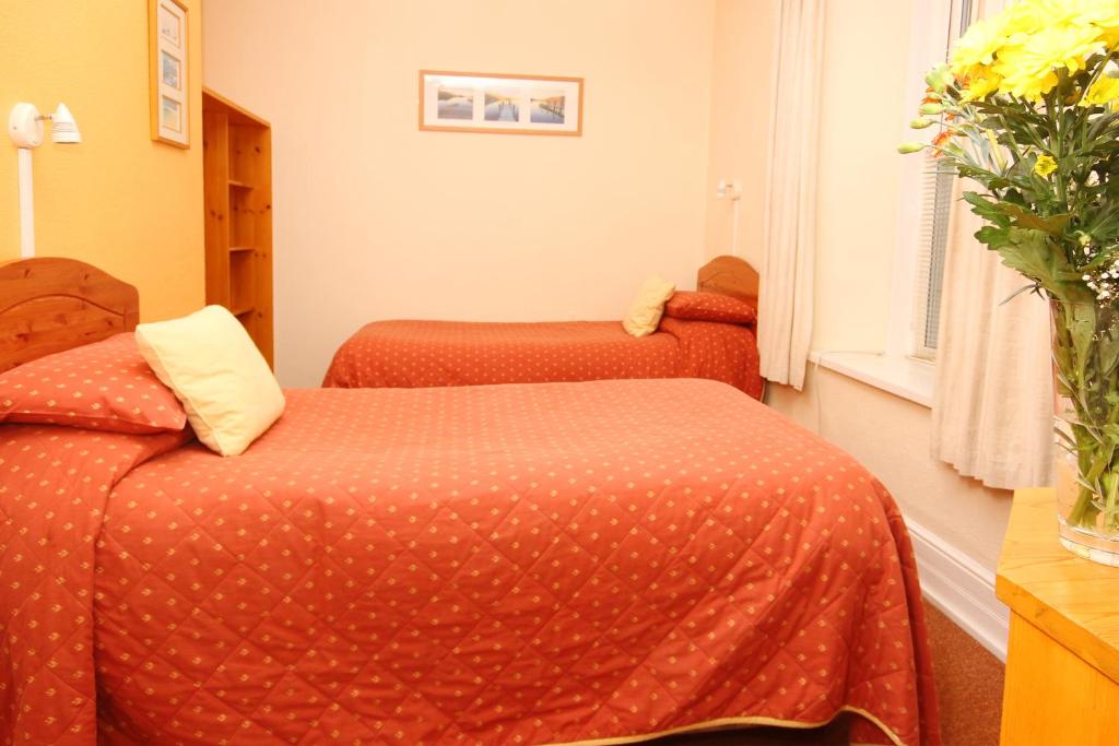 Letto o letti in una camera di Surfside Stop