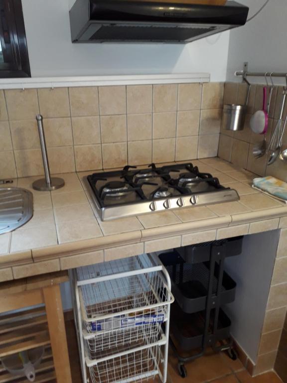 a kitchen counter top with a stove top oven at Blue Beach in Famara