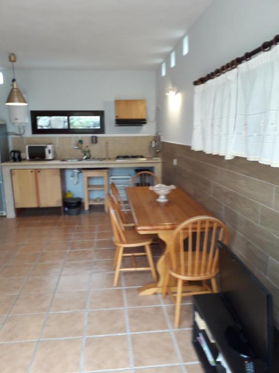 a kitchen and dining room with a table and chairs at Blue Beach in Famara