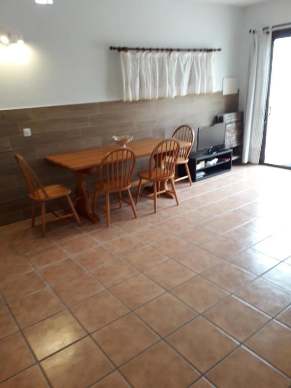 a dining room with a table and chairs at Blue Beach in Famara
