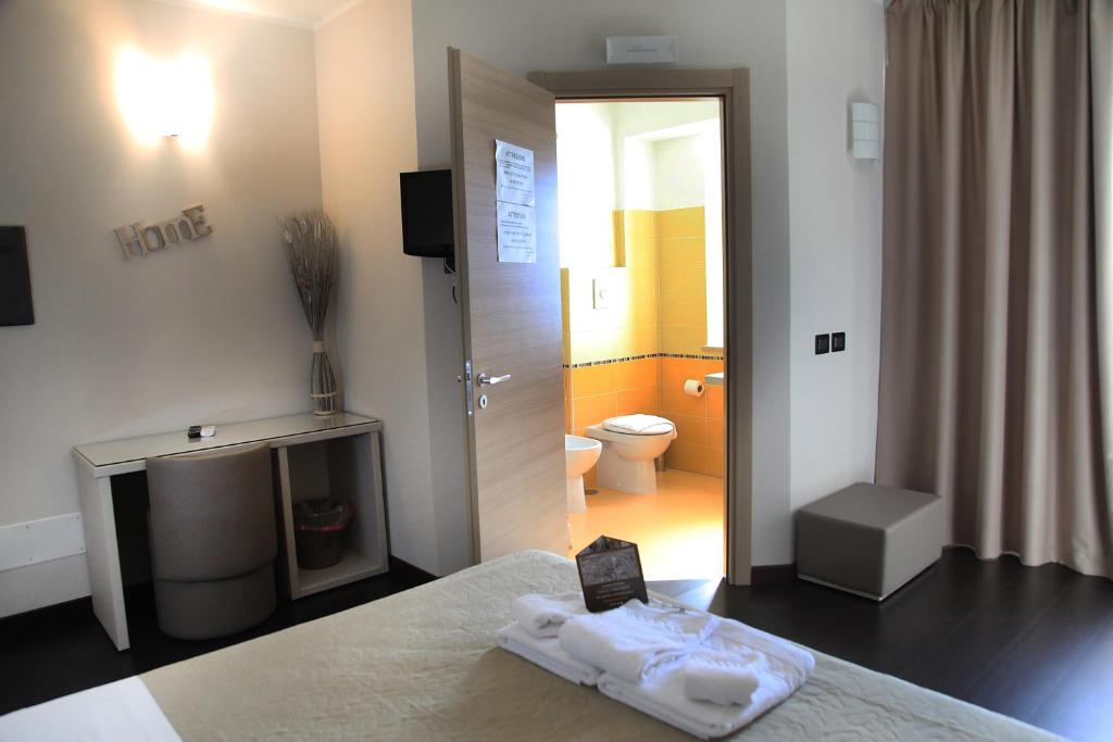 Postel nebo postele na pokoji v ubytování Hotel Sogni D'Oro Airport