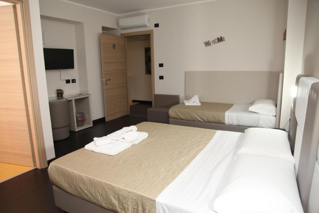 Postel nebo postele na pokoji v ubytování Hotel Sogni D'Oro Airport