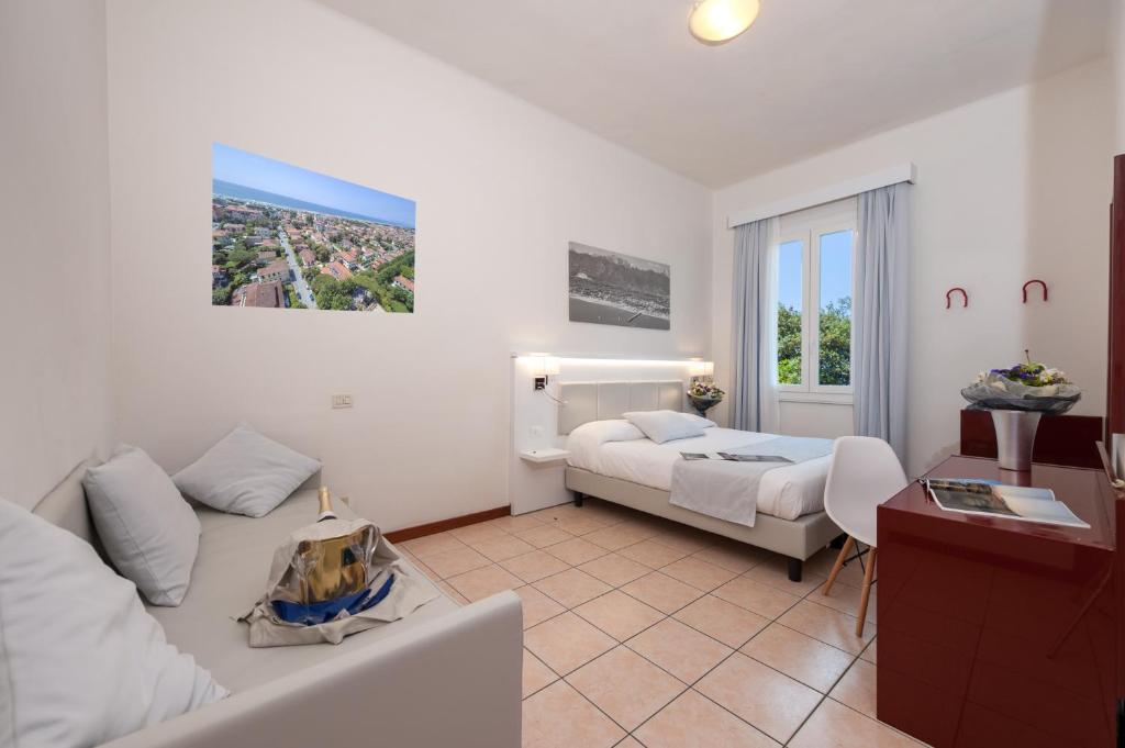 Postel nebo postele na pokoji v ubytování Hotel La Pace