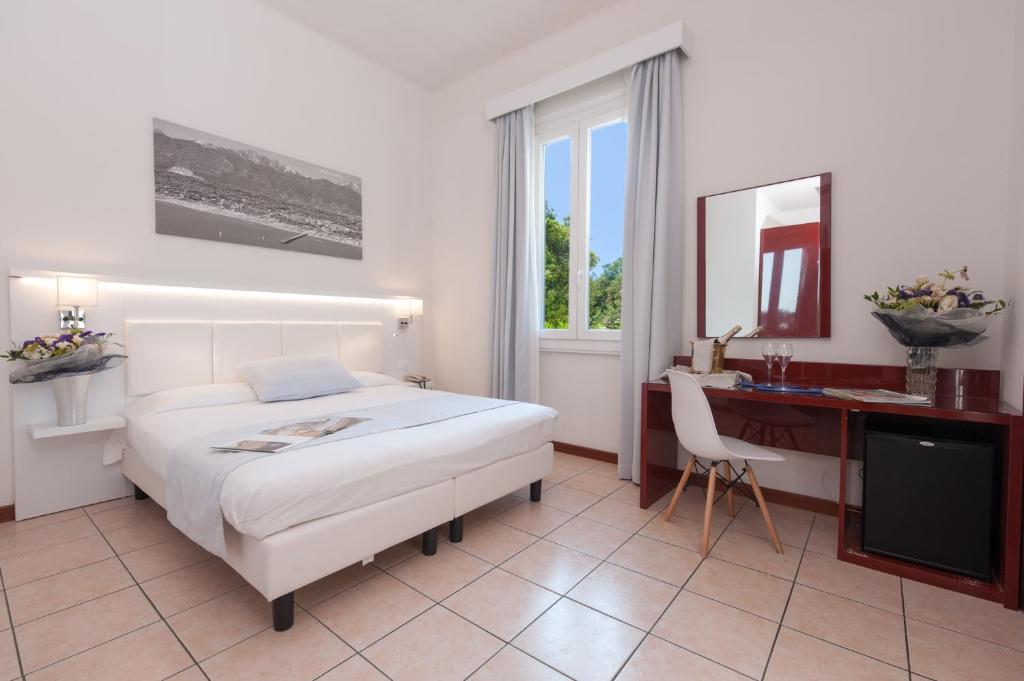 Postel nebo postele na pokoji v ubytování Hotel La Pace