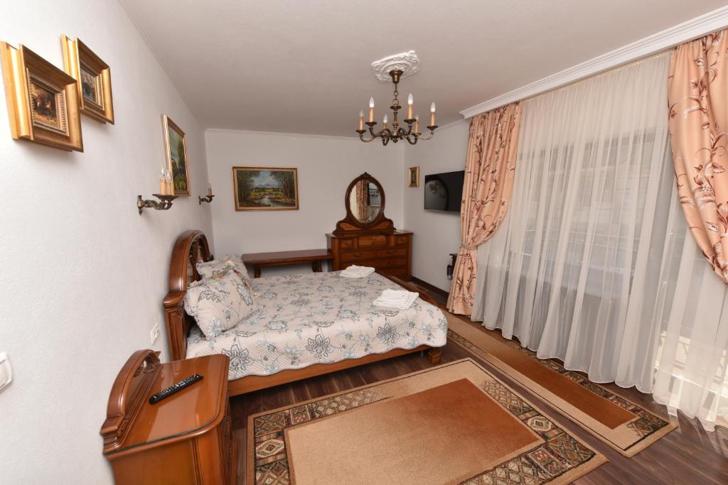 Postel nebo postele na pokoji v ubytování Casa Andrei