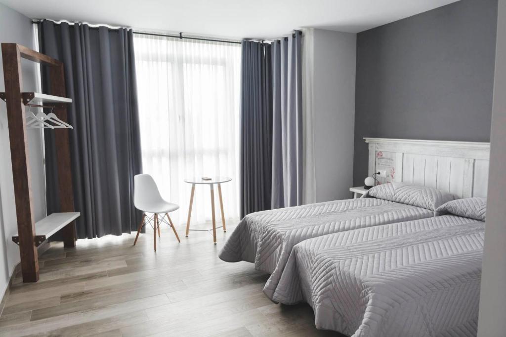 Cama o camas de una habitación en Hotel Mica
