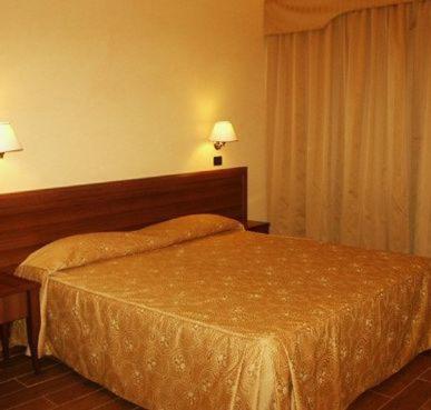 Postel nebo postele na pokoji v ubytování Hotel Cuor Di Puglia