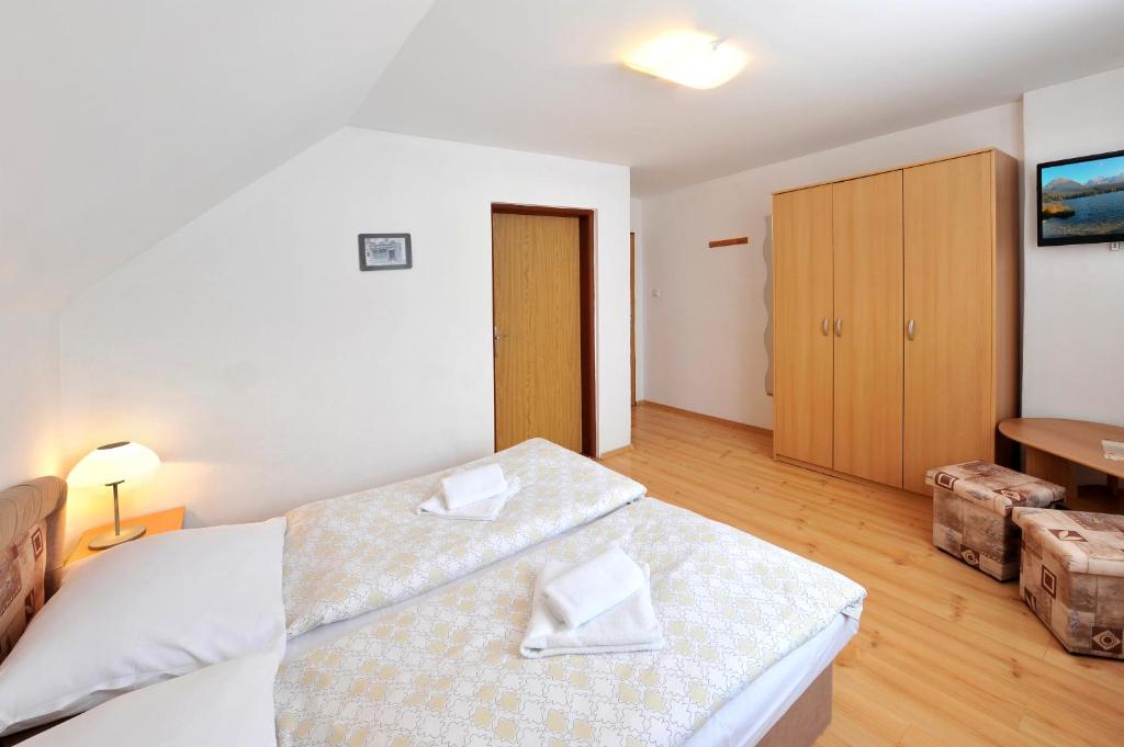Postel nebo postele na pokoji v ubytování Penzion Maco