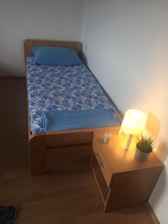 Postel nebo postele na pokoji v ubytování Apartment and Rooms Barbaric