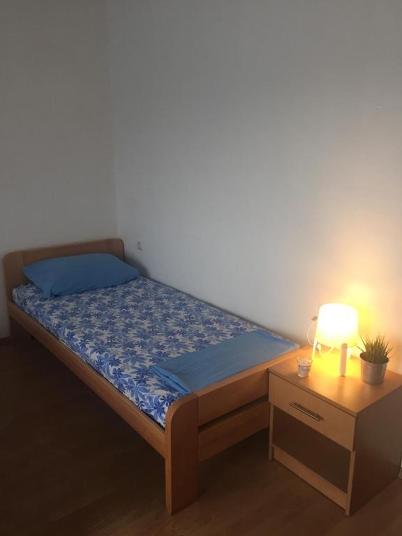 Postel nebo postele na pokoji v ubytování Apartment and Rooms Barbaric