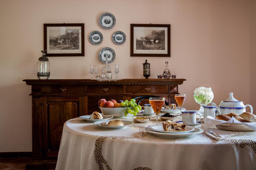a table with plates of food on top of it at La Casa al Sole in Mazara del Vallo