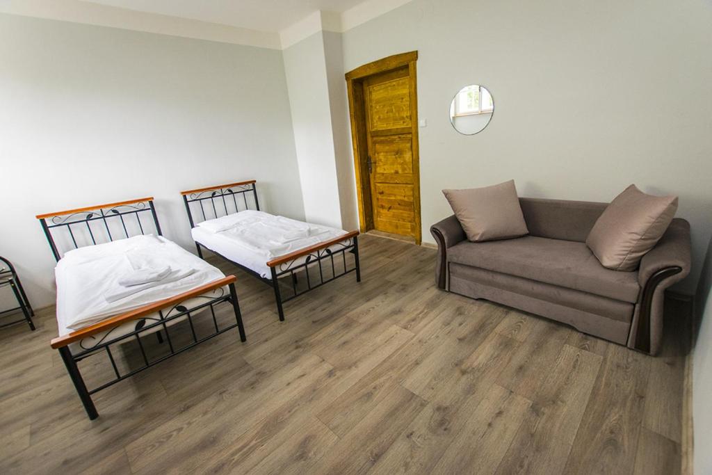 Postel nebo postele na pokoji v ubytování Penzion Klášter