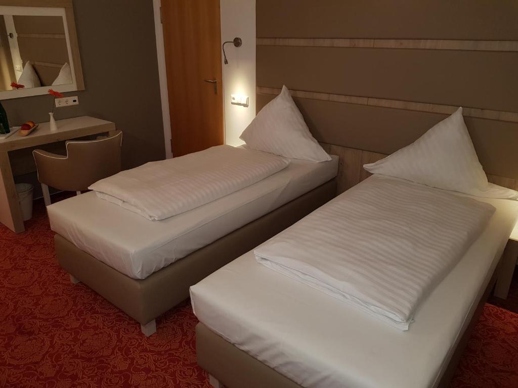 Ein Bett oder Betten in einem Zimmer der Unterkunft Confour Hotel