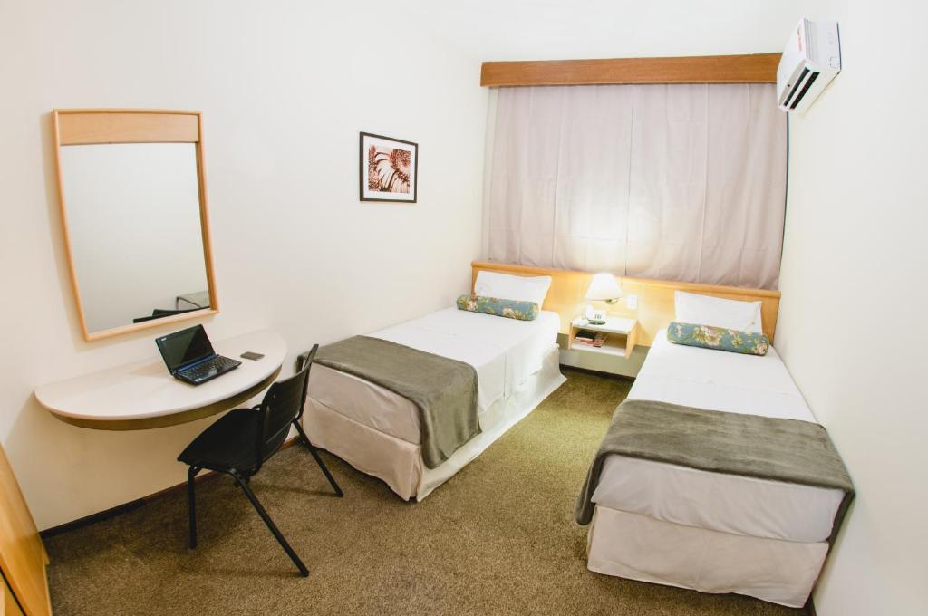 Postel nebo postele na pokoji v ubytování Hotel Aladdin