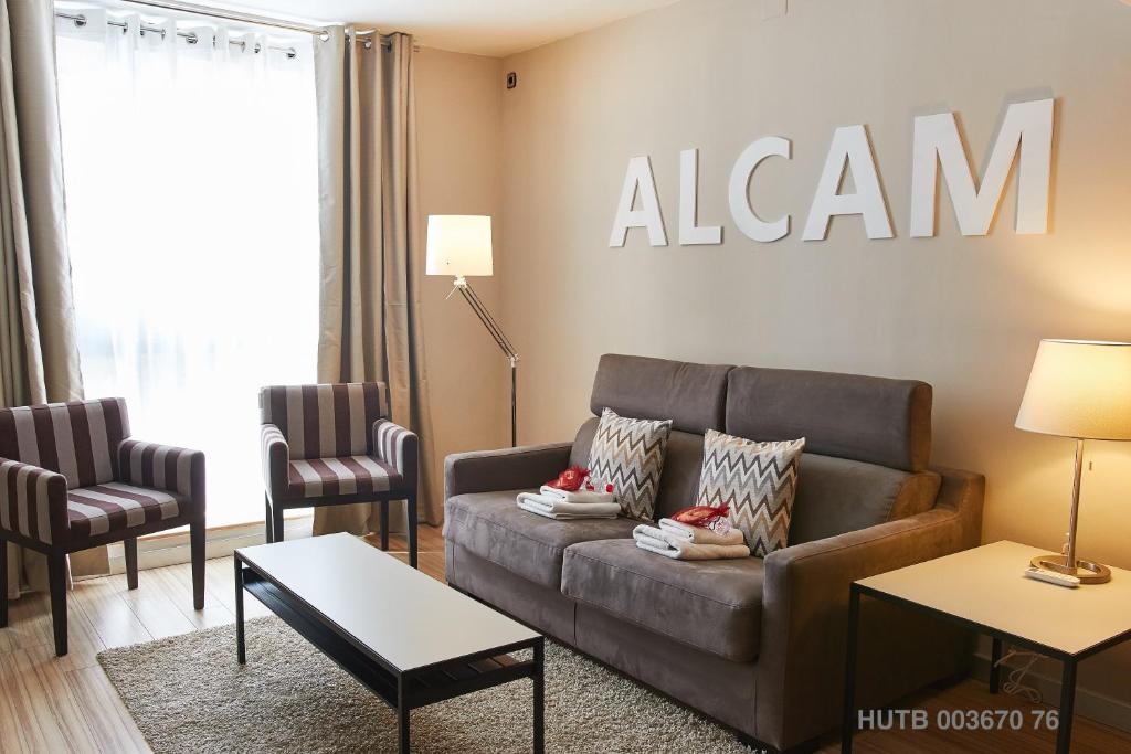 a living room with a couch and two chairs at Alcam Alio 1 in Barcelona