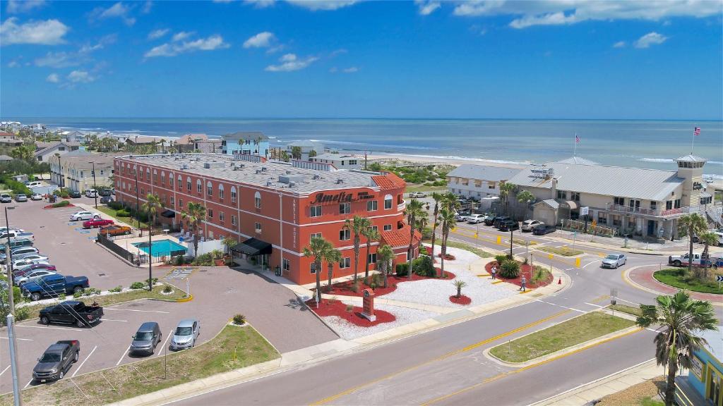 an aerial view of a street with a red brick building at Amelia Hotel at the Beach in Fernandina Beach