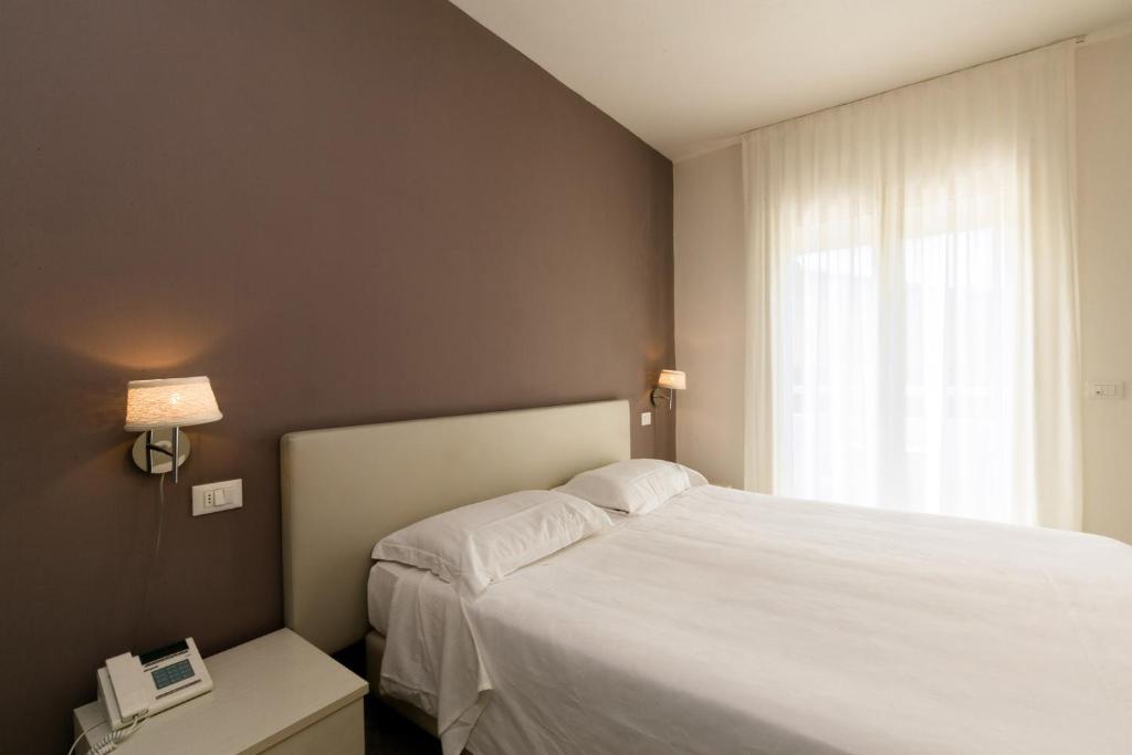 Ліжко або ліжка в номері Hotel Saviola