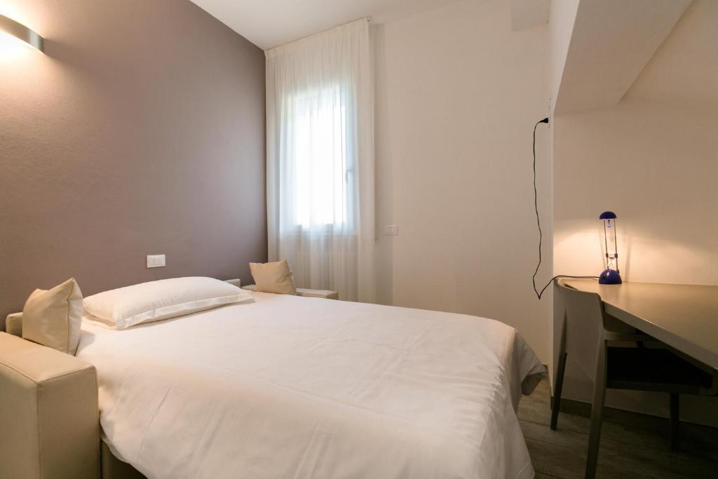 Postel nebo postele na pokoji v ubytování Hotel Saviola