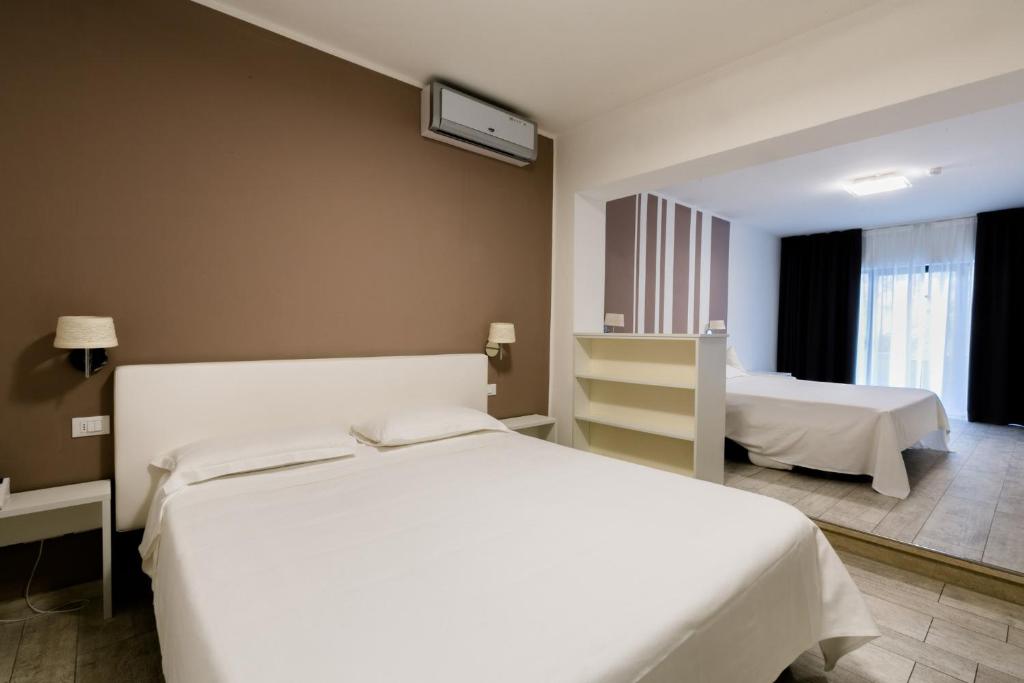 Postel nebo postele na pokoji v ubytování Hotel Saviola
