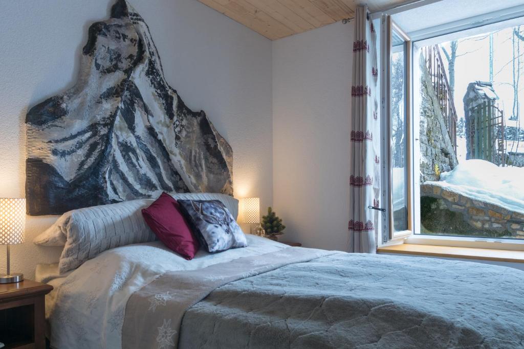 Postel nebo postele na pokoji v ubytování La Ferme des Arêtes