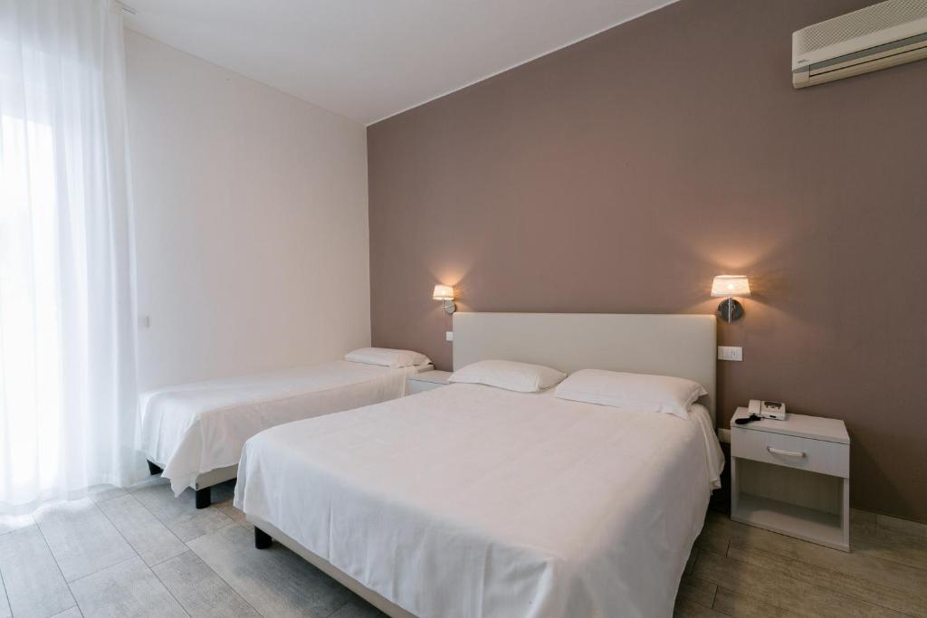 Postel nebo postele na pokoji v ubytování Hotel Saviola