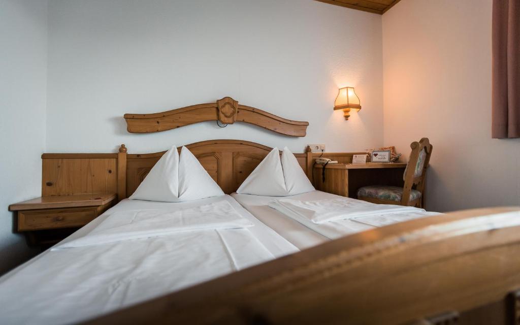 Postel nebo postele na pokoji v ubytování Hotel Restaurant Schwartz