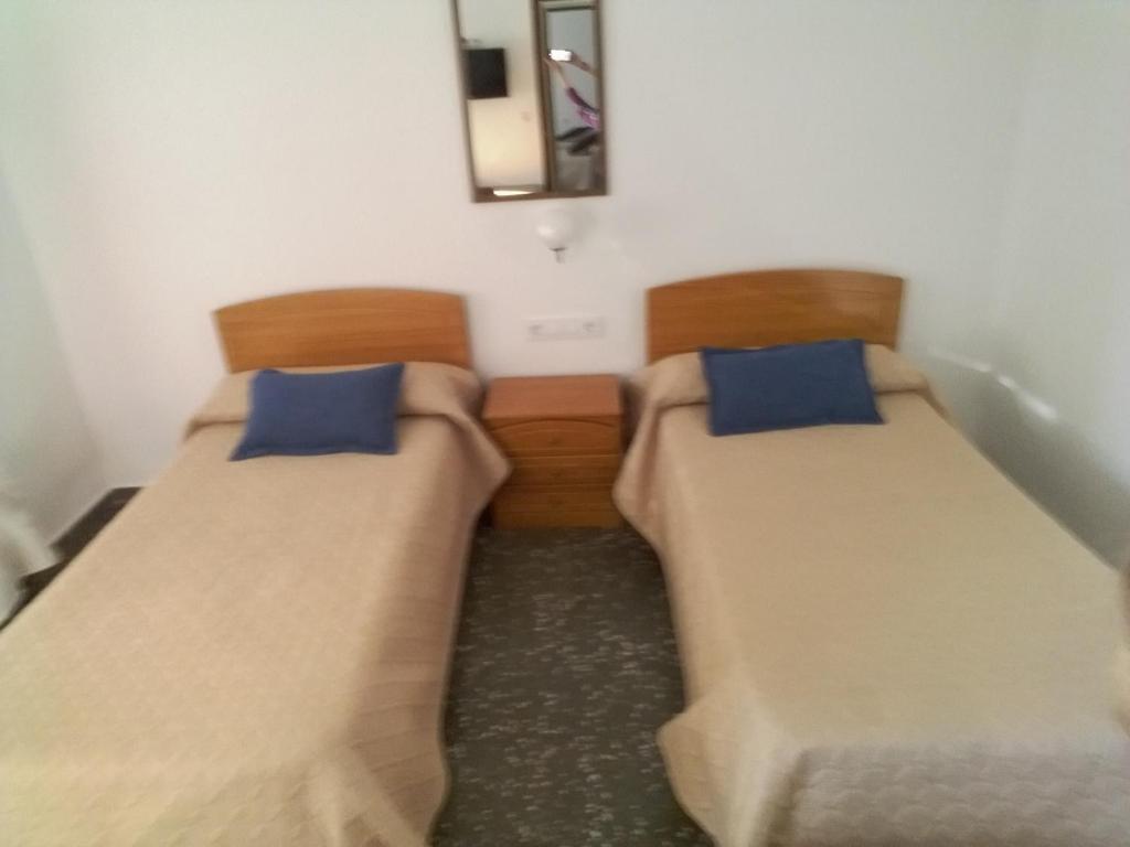 Cama o camas de una habitación en Pensíon Lucia