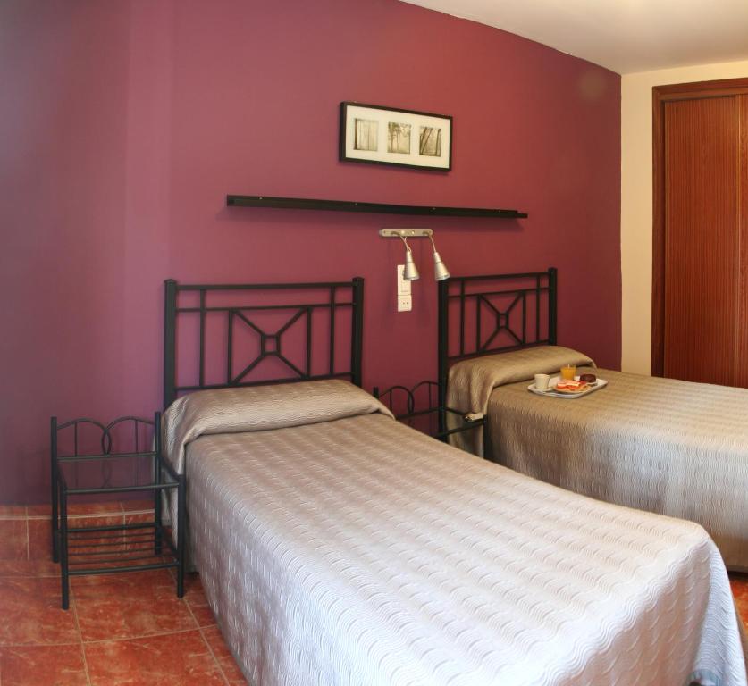 Postel nebo postele na pokoji v ubytování Hostal Jentoft